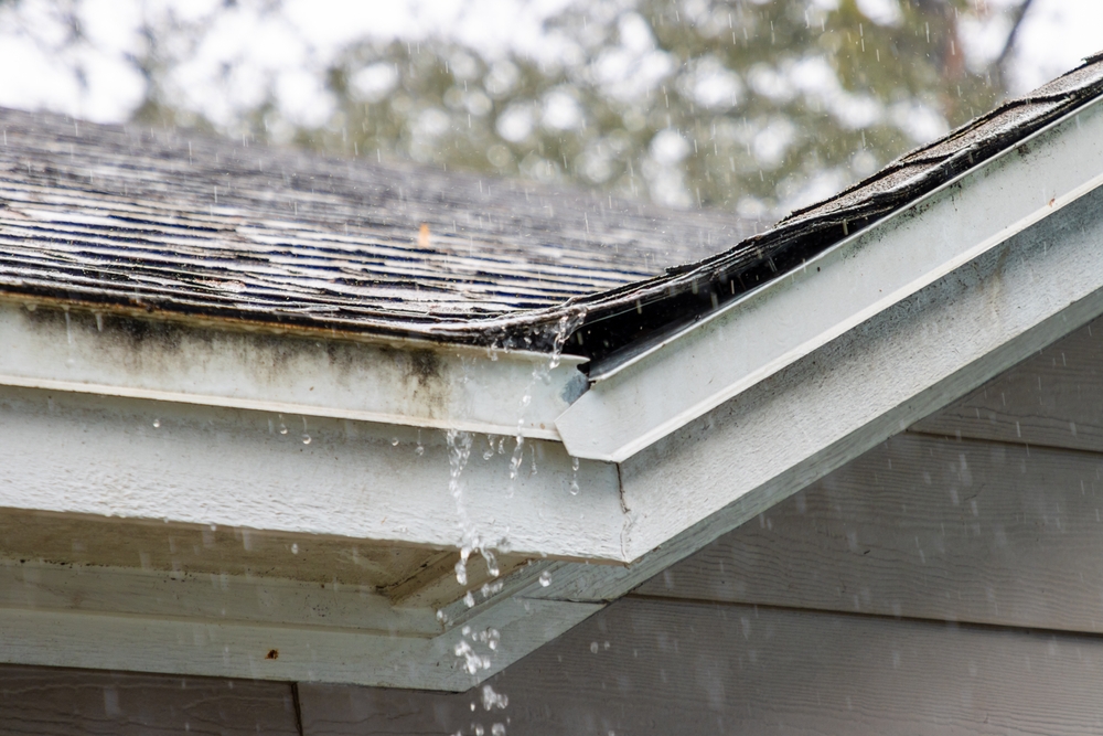 Rain,Splashing,And,Falling,Off,Roof,Of,House